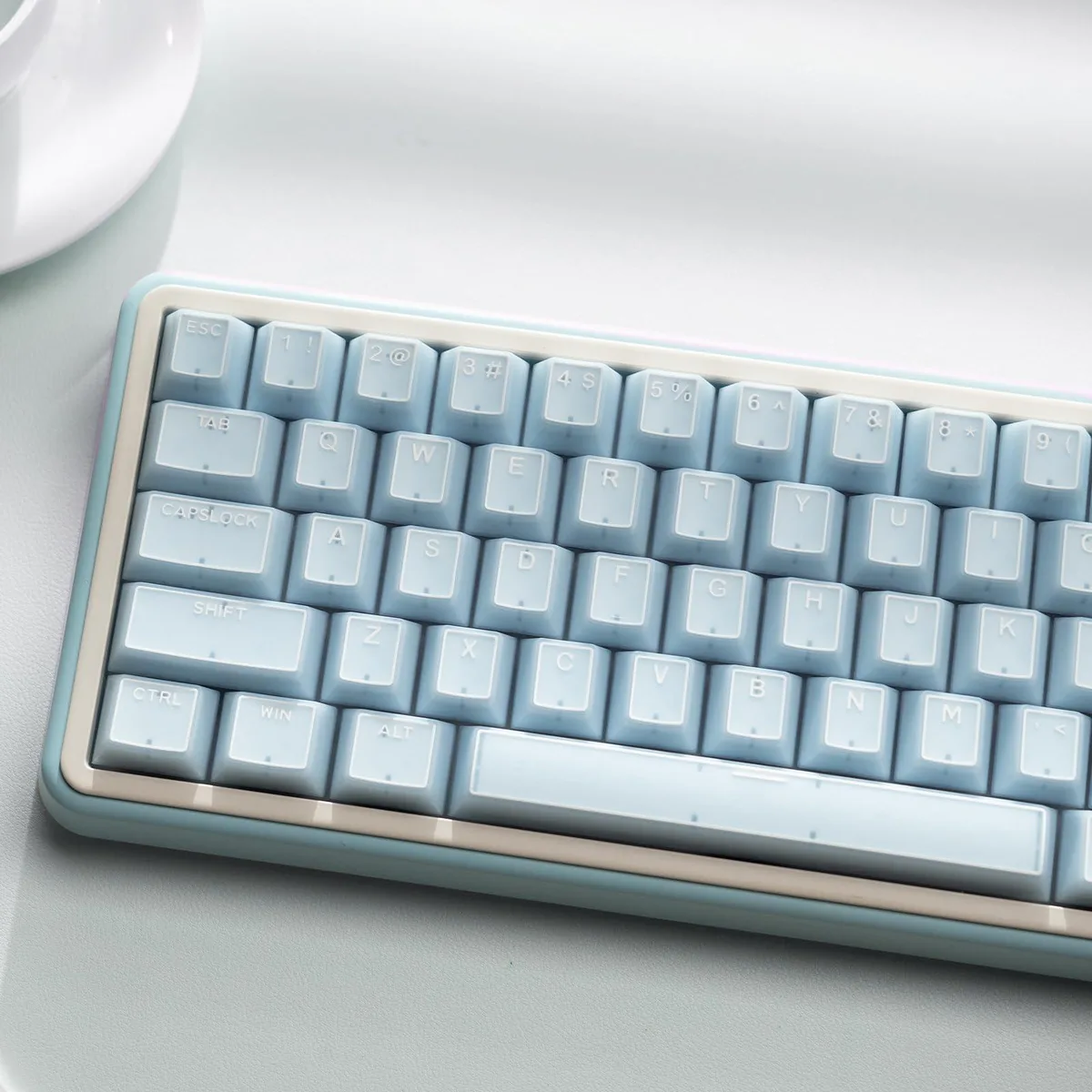 142 translucent blue-white keycaps in Cherry profile with double-shot legends and a keycap puller