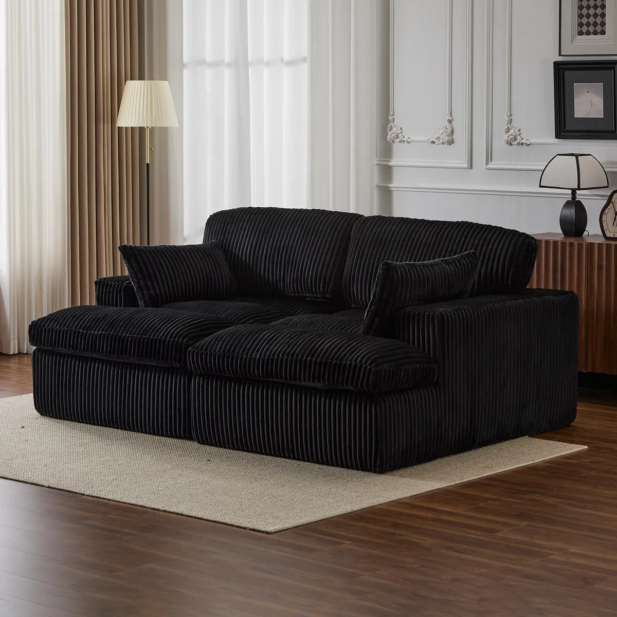 Black corduroy double chaise lounge with deep cushions