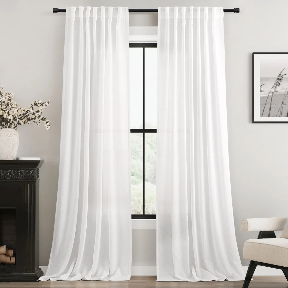 Two white linen blend curtain panels with back tabs and rod pockets, 52 inches wide by 84 inches long