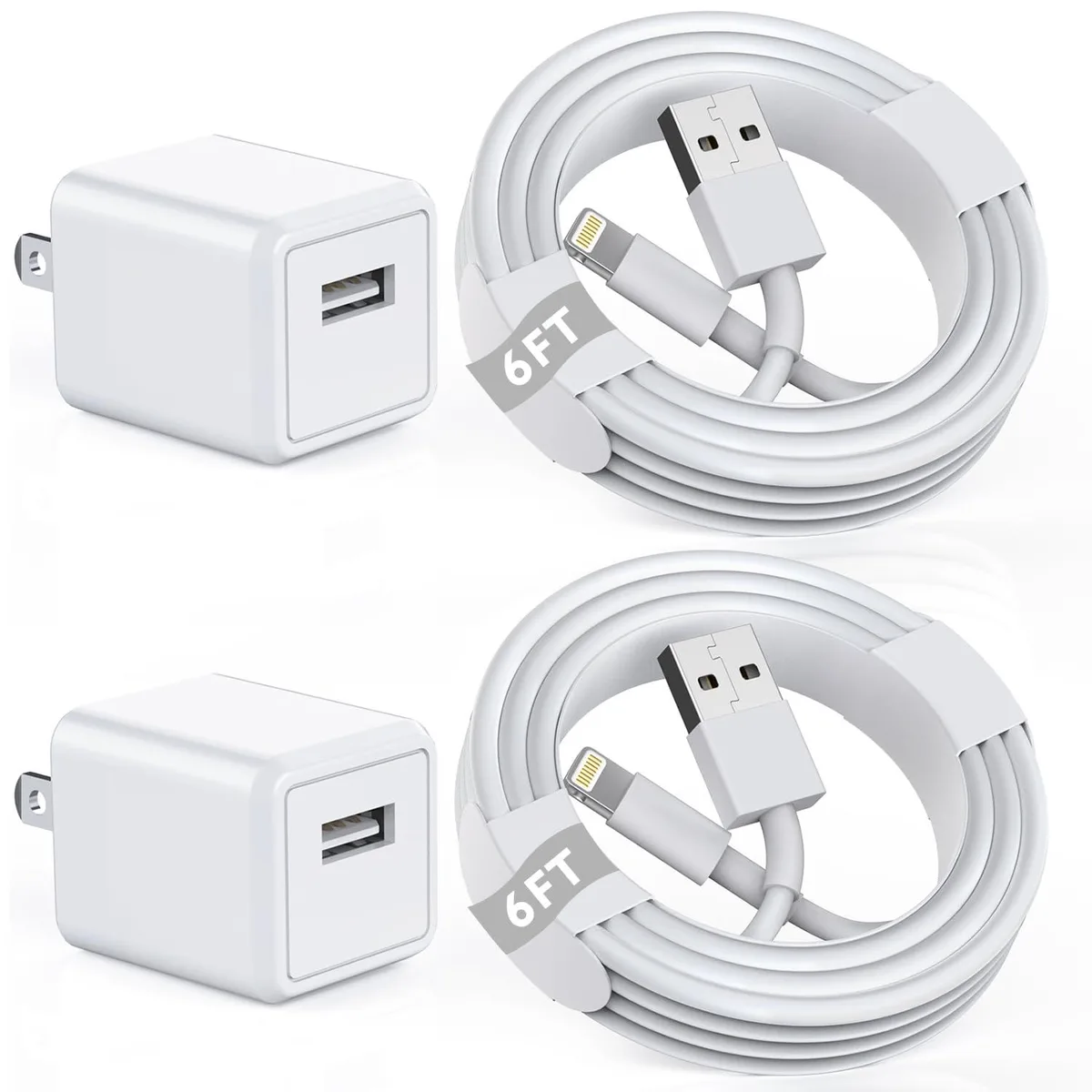 Two white Lightning cables and a USB-C wall charger on a plain background