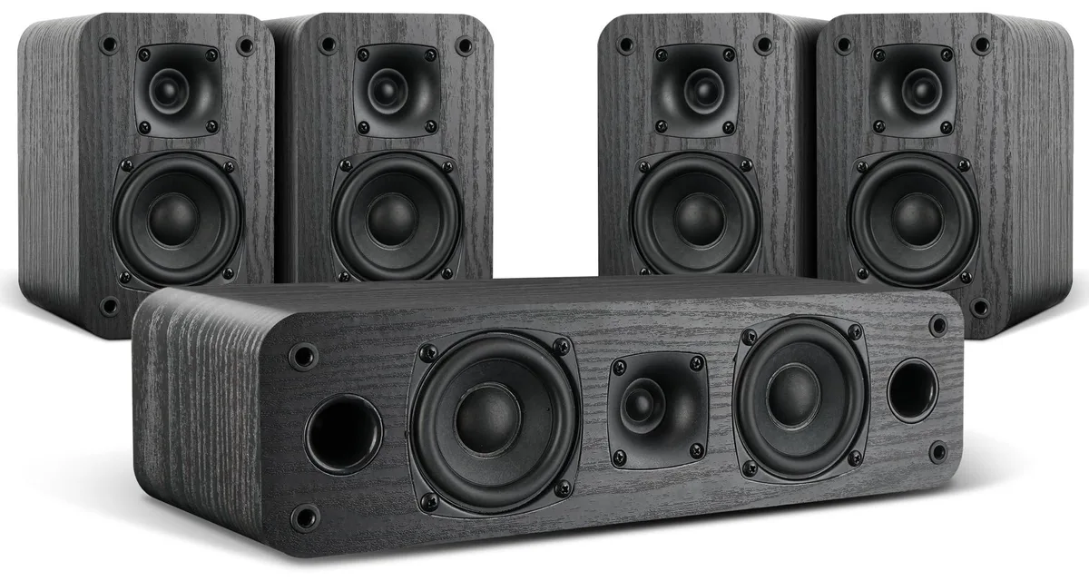 Five black passive speakers, four bookshelf and one centre, wood-grain cabinets, compact rectangular shape