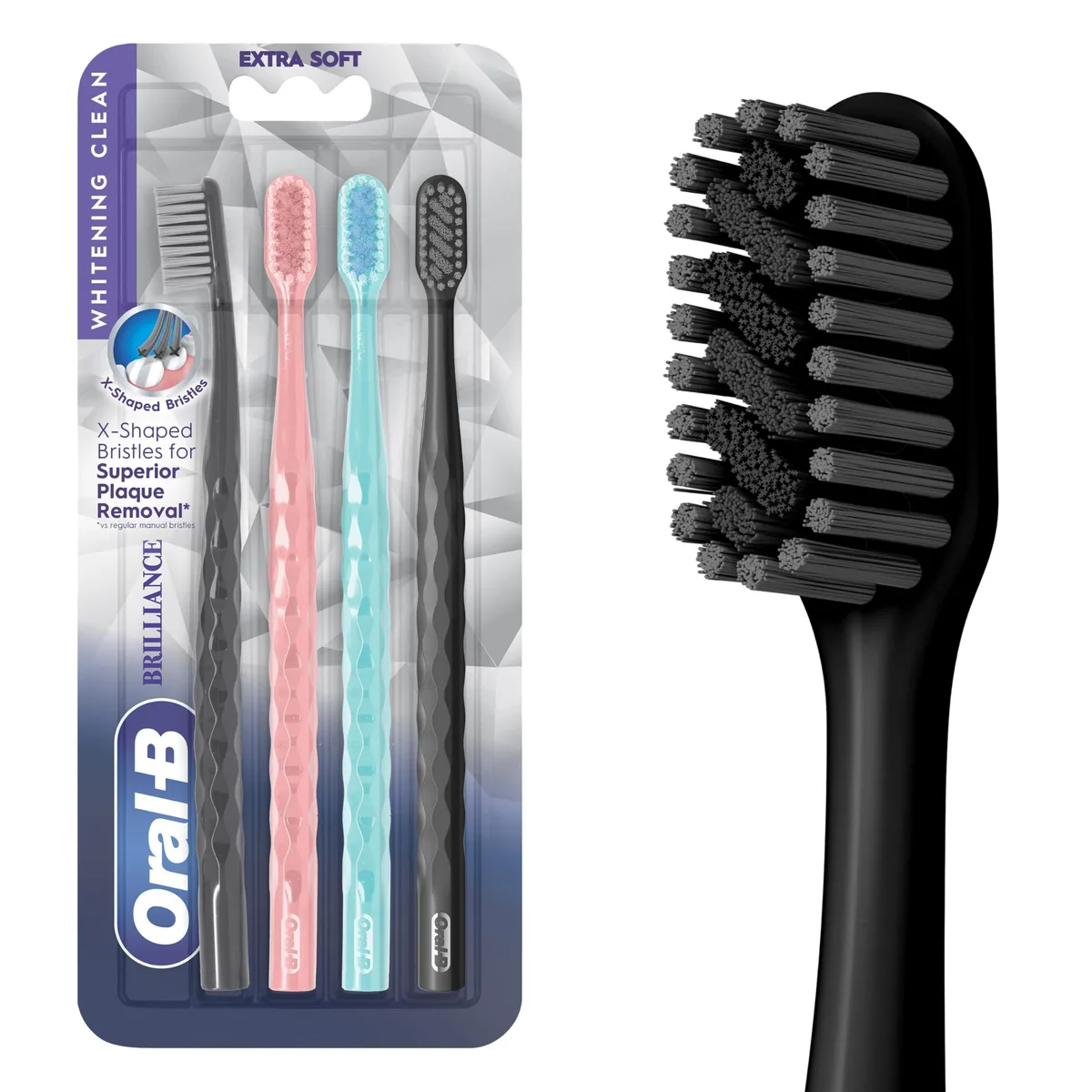 Four manual toothbrushes in black, coral and teal with extra-soft bristles and ergonomic handles