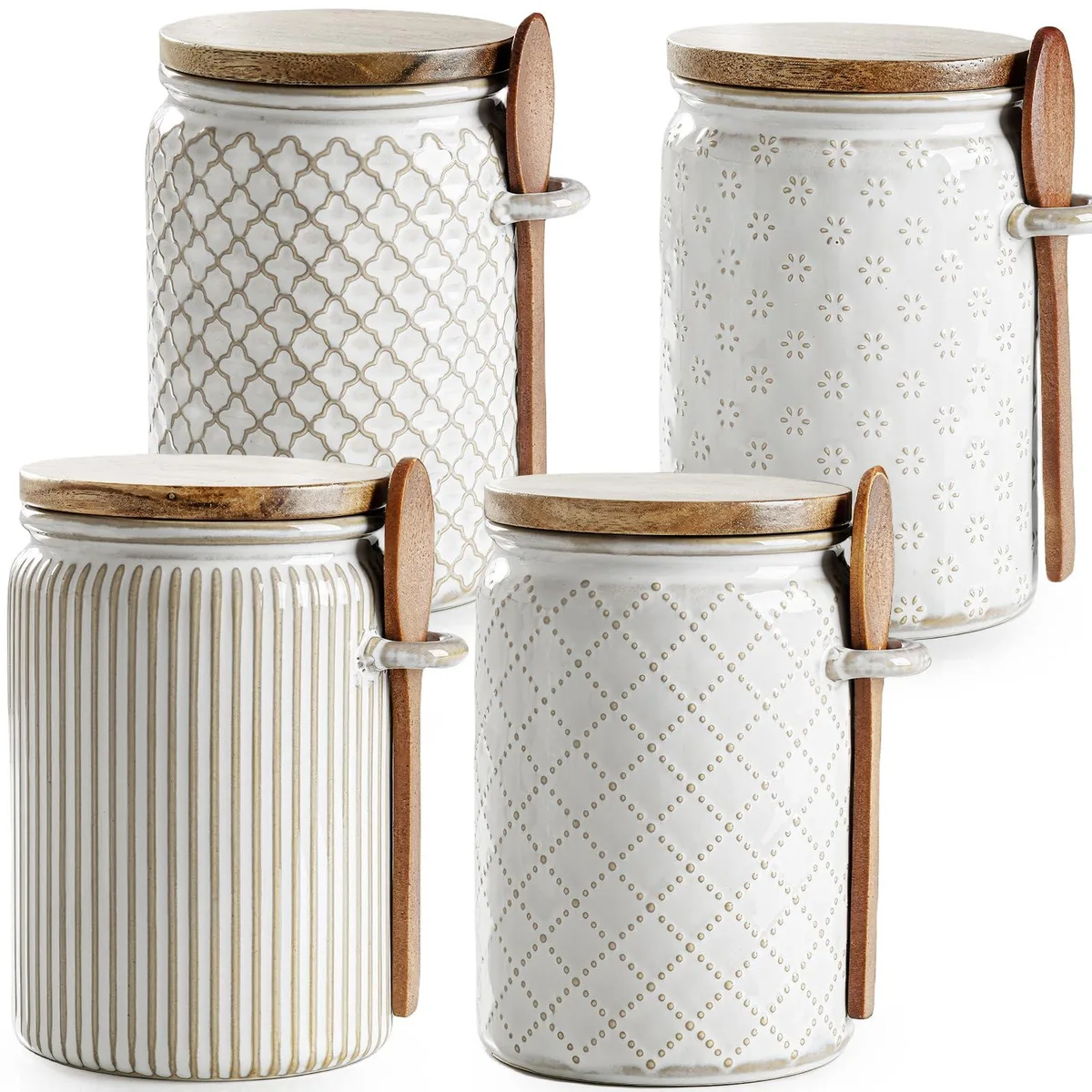 Four white ceramic canisters with wood lids and spoons
