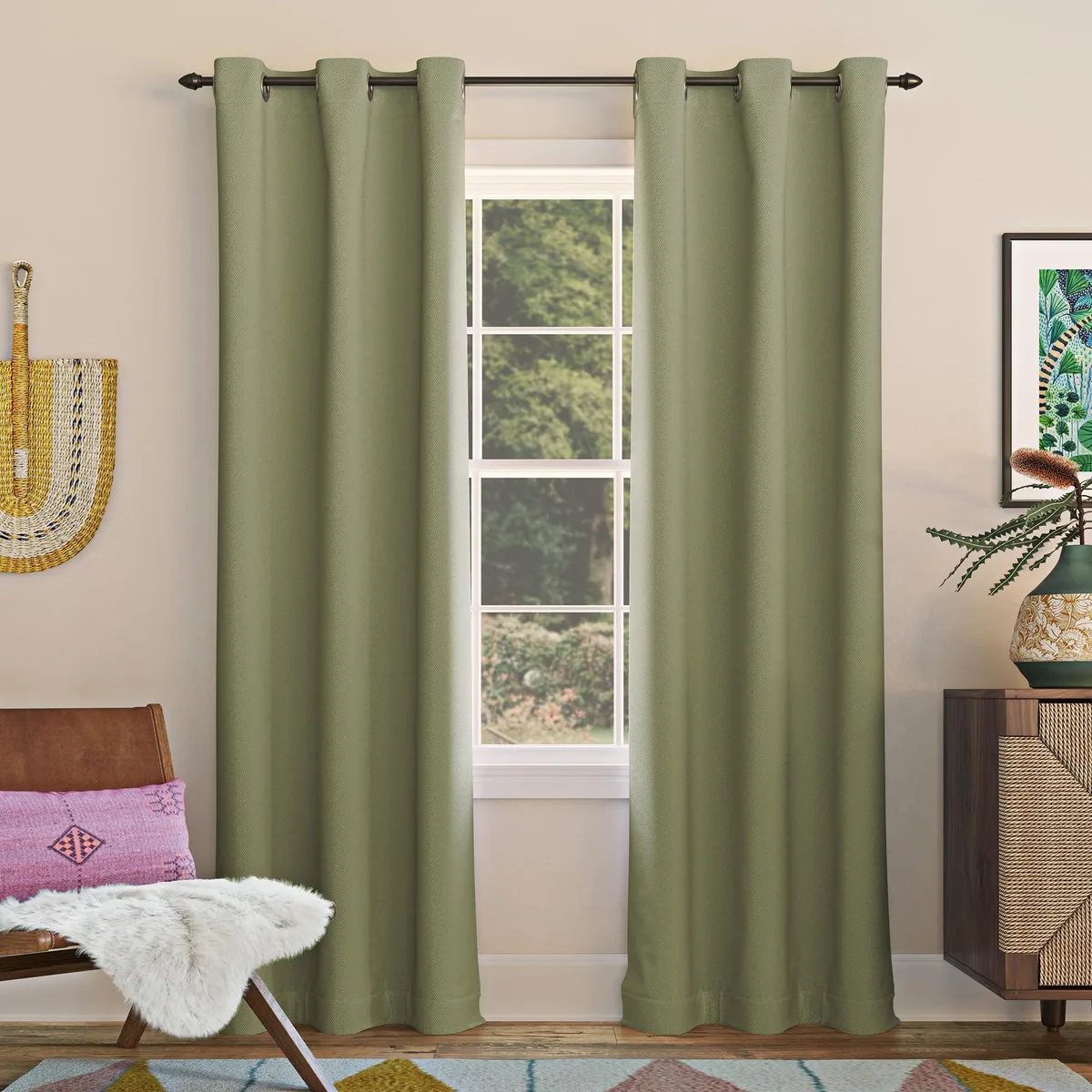 Single sage green blackout curtain panel with silver grommets, polyester fabric, 40 by 84 inches
