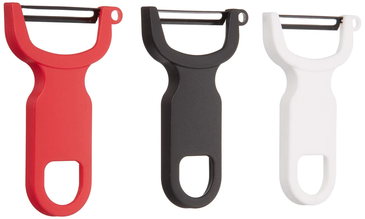 Seven black Y-shaped peelers with ergonomic polypropylene handles and stainless steel blades