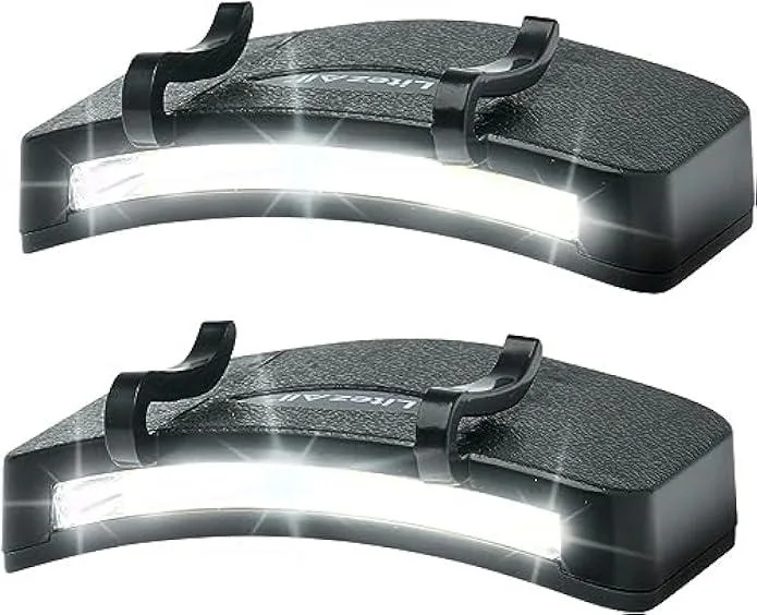 Two compact clip-on LED lights with spring clips and COB panels, matte black finish