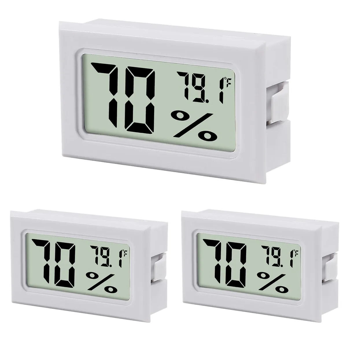 Three small white digital thermometer hygrometers with LCD screens