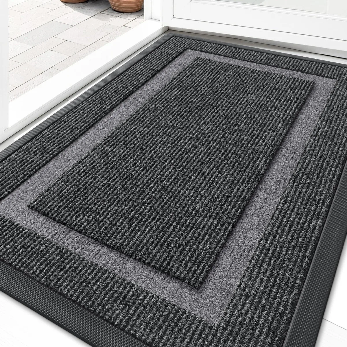 Grey rectangular door mat with striped pattern and low profile, 29.5 by 17 inches