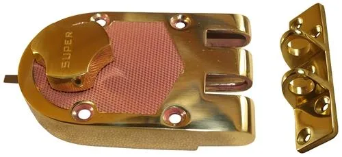 Surface-mounted bronze deadbolt with polished brass rim cylinder and triangular thumb turn