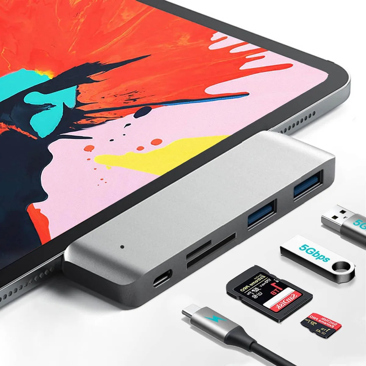 Compact black aluminium USB-C hub with two USB-A ports, USB-C PD port, SD and microSD slots, indicator light