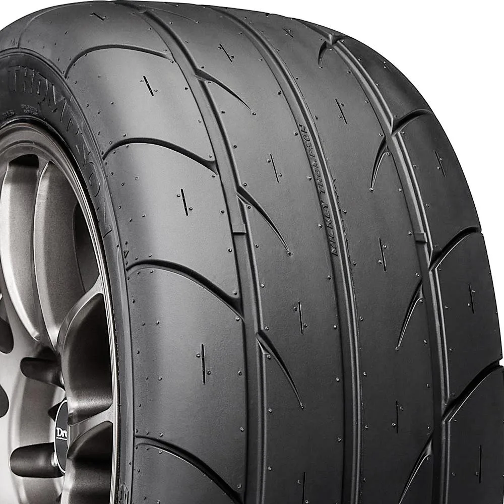Black sidewall high-performance summer tire with directional tread pattern mounted on 20-inch rim