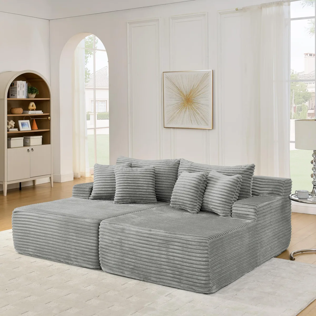 Grey velvet two-seater floor lounge chair, compressed in box