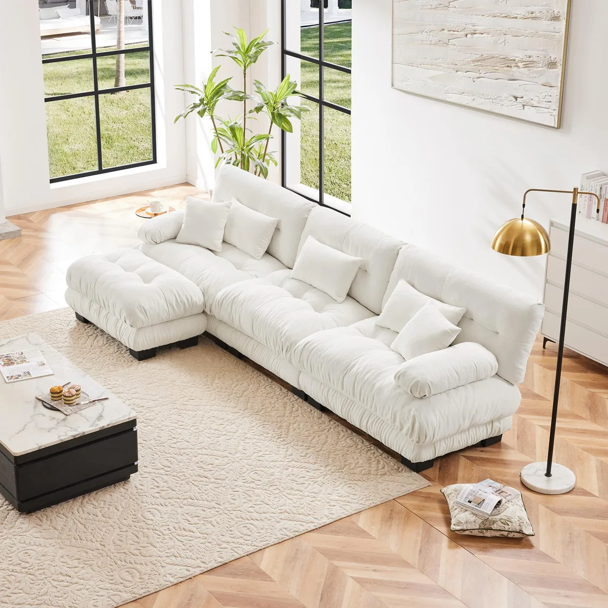 White L-shaped modular sectional sofa in chenille fabric with rounded bolster armrests, deep cushions