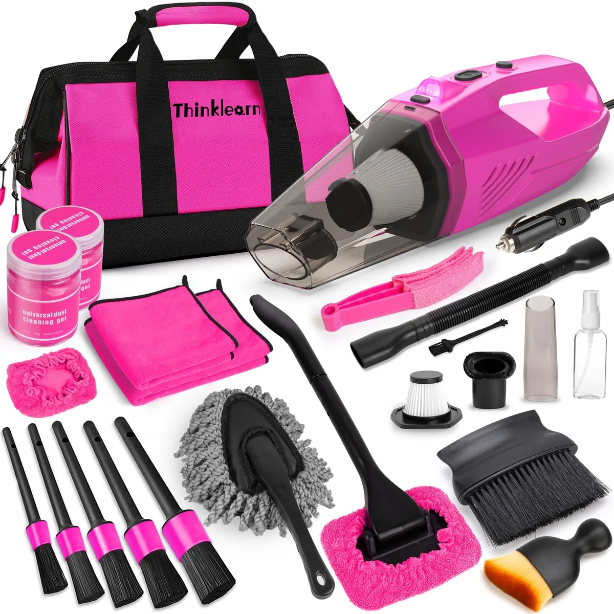 Pink corded handheld vacuum with brush attachments in padded storage bag