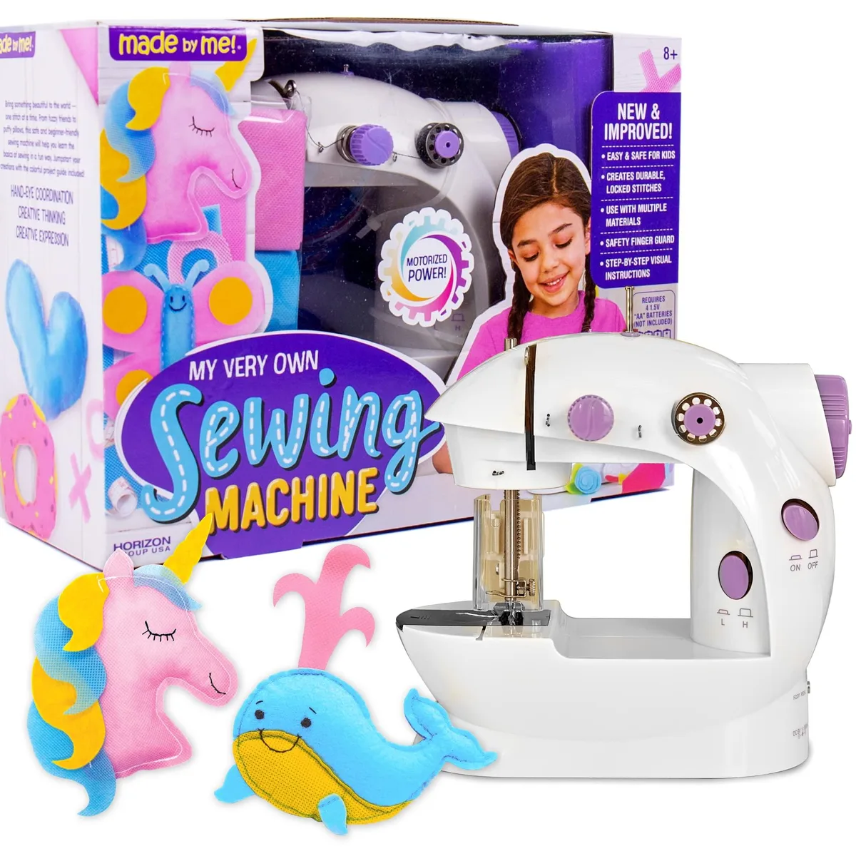 Compact white and pink battery sewing machine with fabric sheets, thread spools and accessories