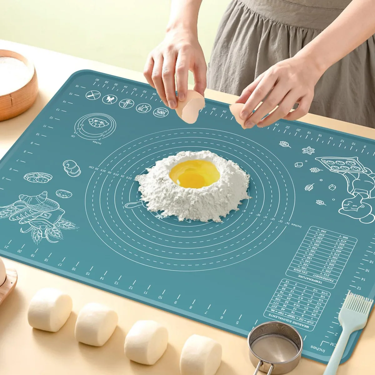 Two indigo silicone pastry mats 24 by 16 inches with raised edges and measurement markings