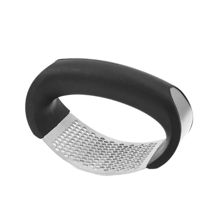 Stainless steel paddle-style garlic crusher with curved handle and perforated surface
