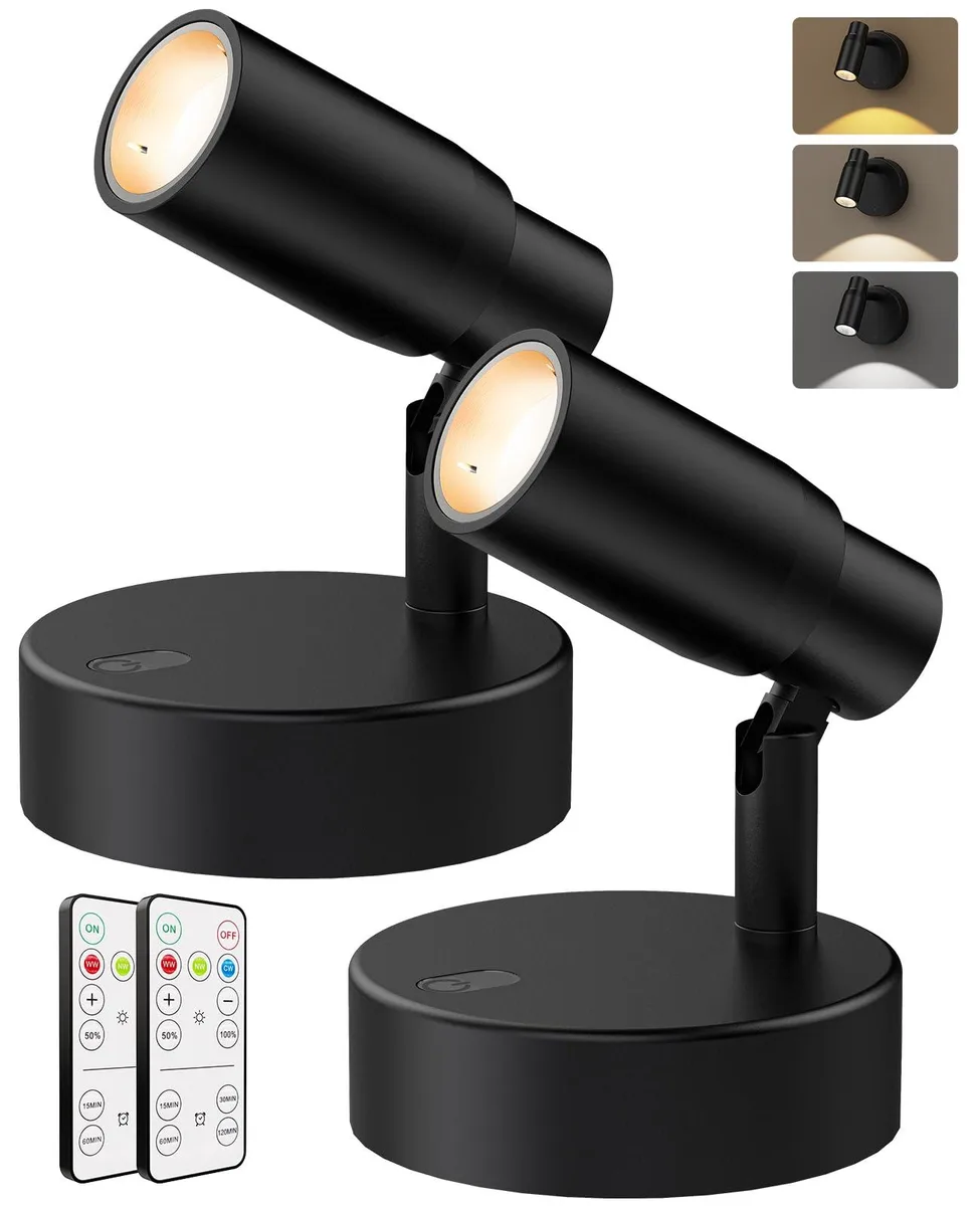 Two white cylindrical LED spotlights with clear prismatic lenses and remote control