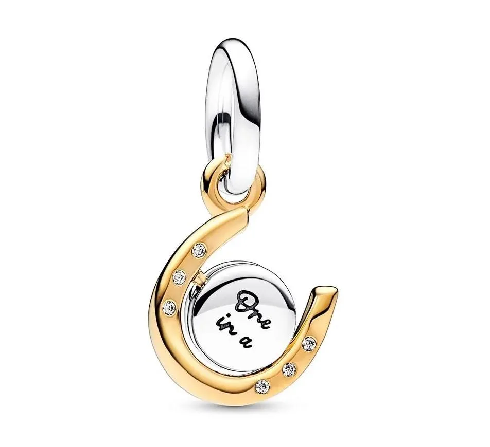 PANDORA PANDORA Two-tone Spinning Disc Horseshoe Dangle Charm 14k gold-plated — product photo