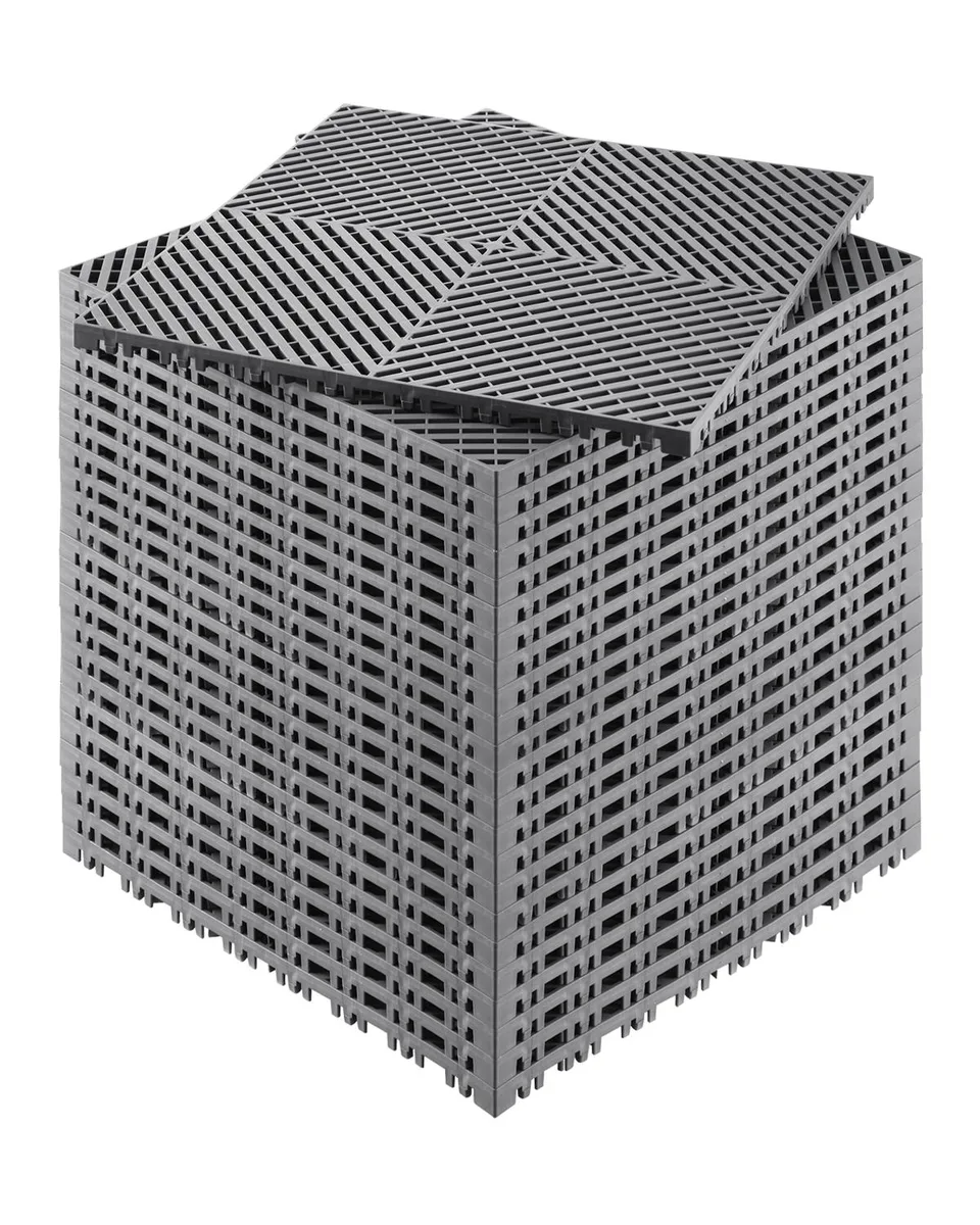 Twenty-four gray interlocking drainage tiles with open-grid surface and raised edges