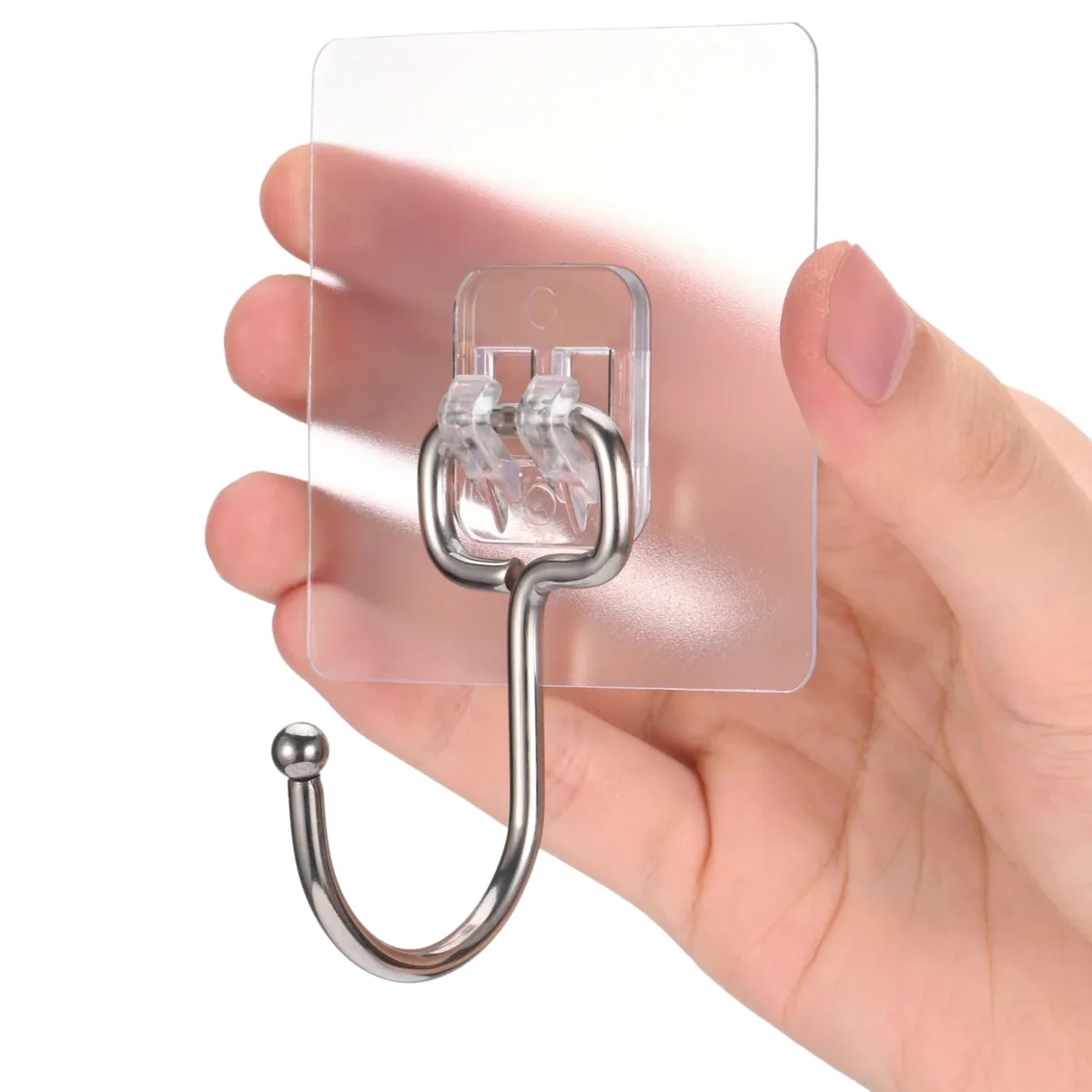 Twelve clear square adhesive hooks on a sheet