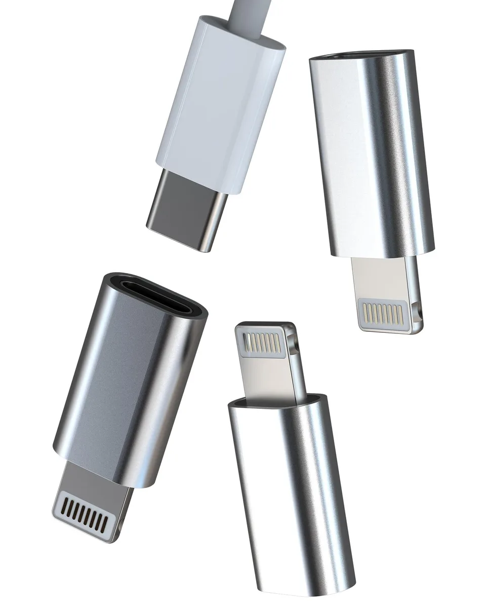 Three small white adapters with Lightning plugs and USB-C ports