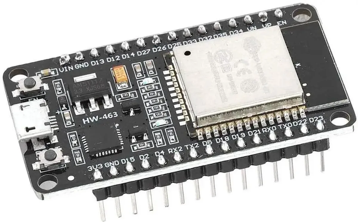 Green rectangular circuit board with ESP32 chip and pin headers