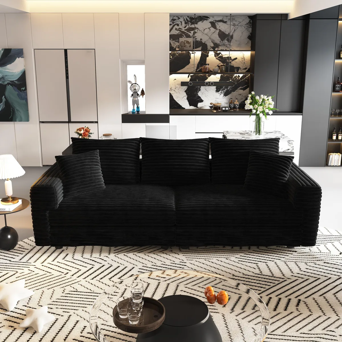 Black corduroy three-seat sofa with deep cushions and movable ottomans