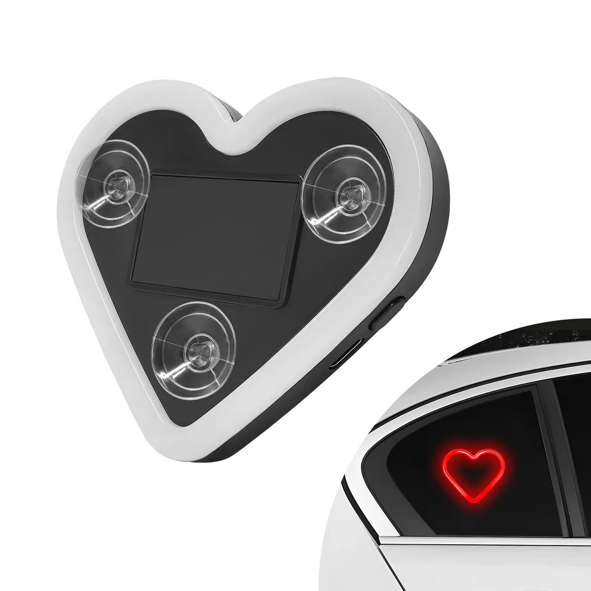 Heart-shaped red LED lamp with solar panel and three suction cups on glass