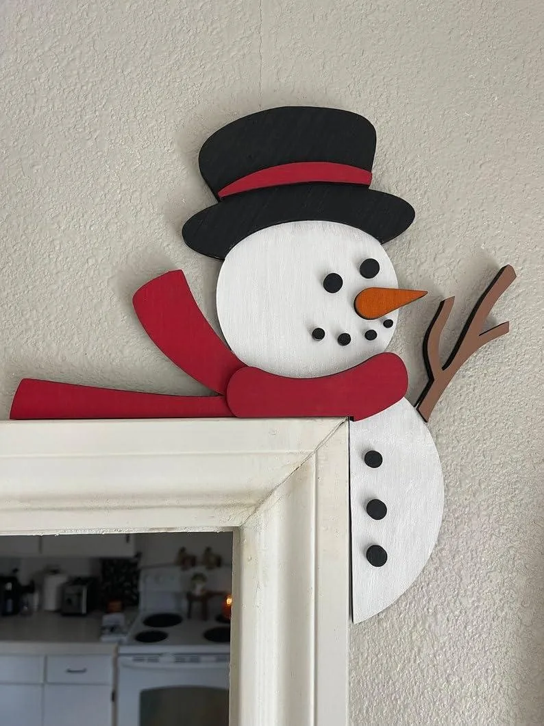 Wooden snowman door topper with red LED light and blue wire