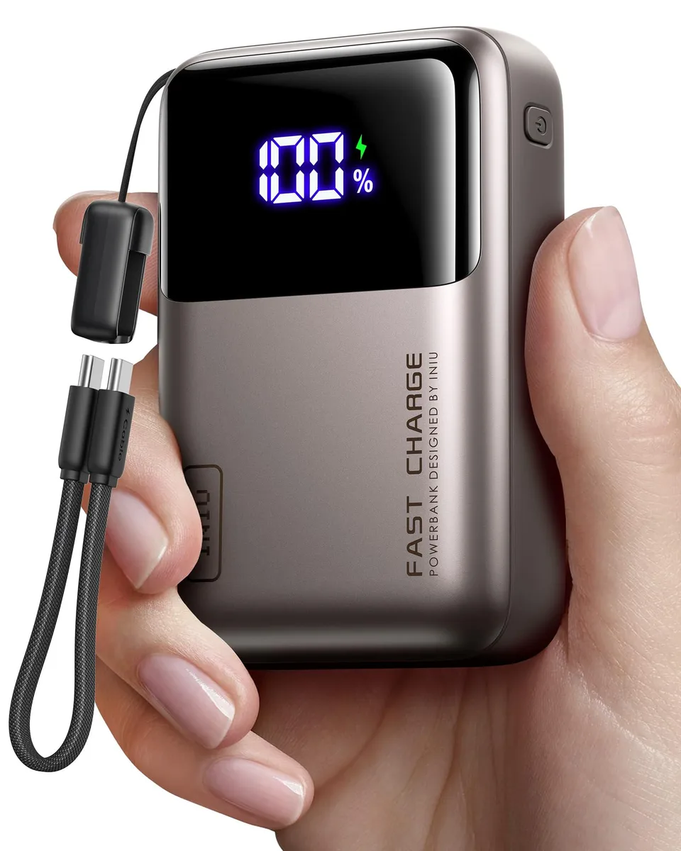 Rectangular metallic coffee power bank with two USB-C ports one USB-A port and a short braided USB-C lanyard cable attached
