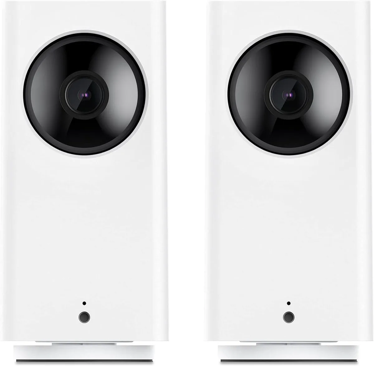Two white indoor cameras on a surface, each with a rotating base and tilting lens housing