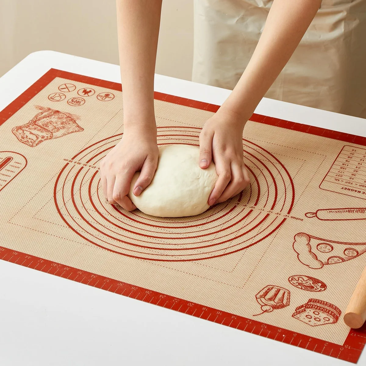 Large rectangular silicone baking mat with checkered measurement grid and reinforced edges