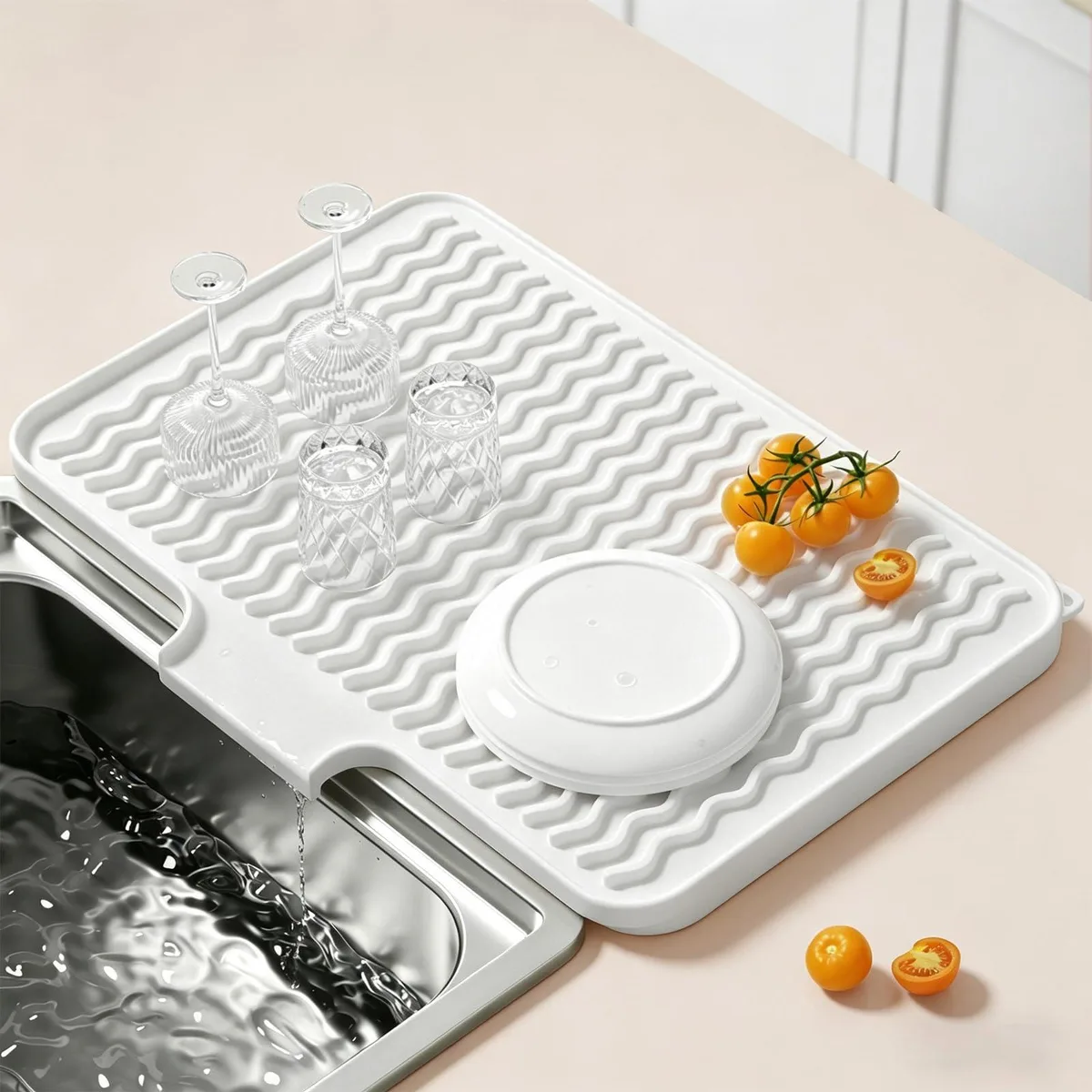 White rectangular silicone drying mat 16 by 12 inches with wavy ridges and side drainage spout