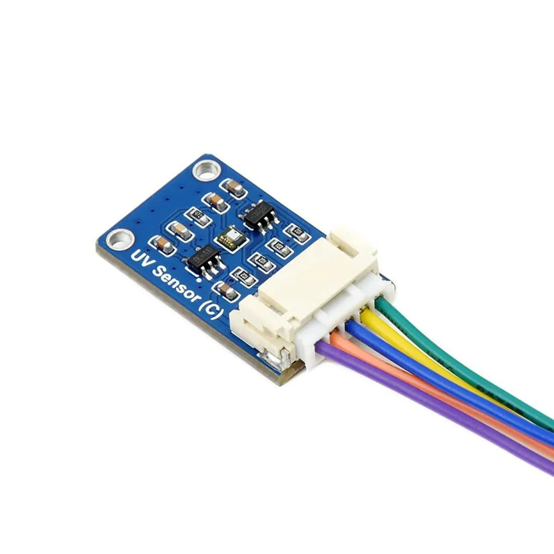 Small rectangular green circuit board with a silver sensor chip and gold header pins