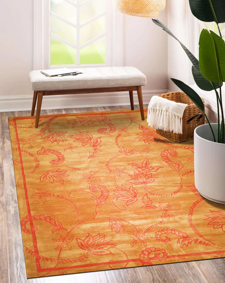 Hand-tufted wool area rug in brown with abstract yellow pattern, cotton backing, low pile