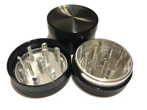 Small black two-piece herb shredder with hard top, 1.5 inch diameter, aircraft-grade aluminium finish