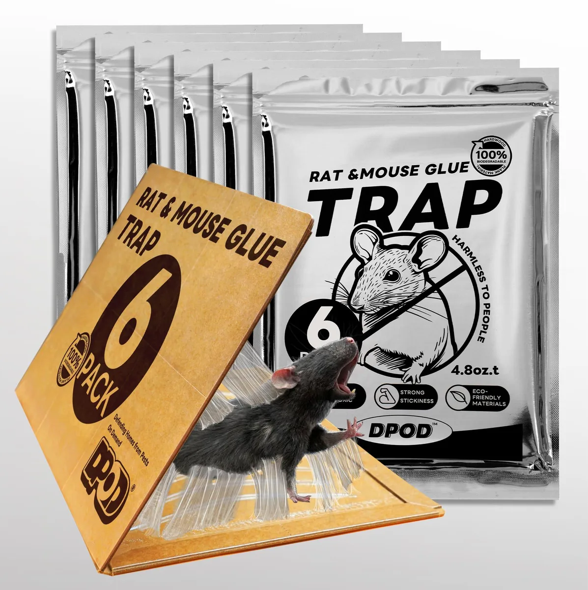 Six white cardboard glue traps on a flat surface