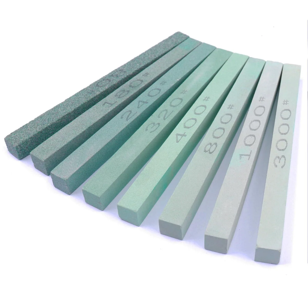Eight rectangular blue stoneware sticks, each about six inches long and half an inch square