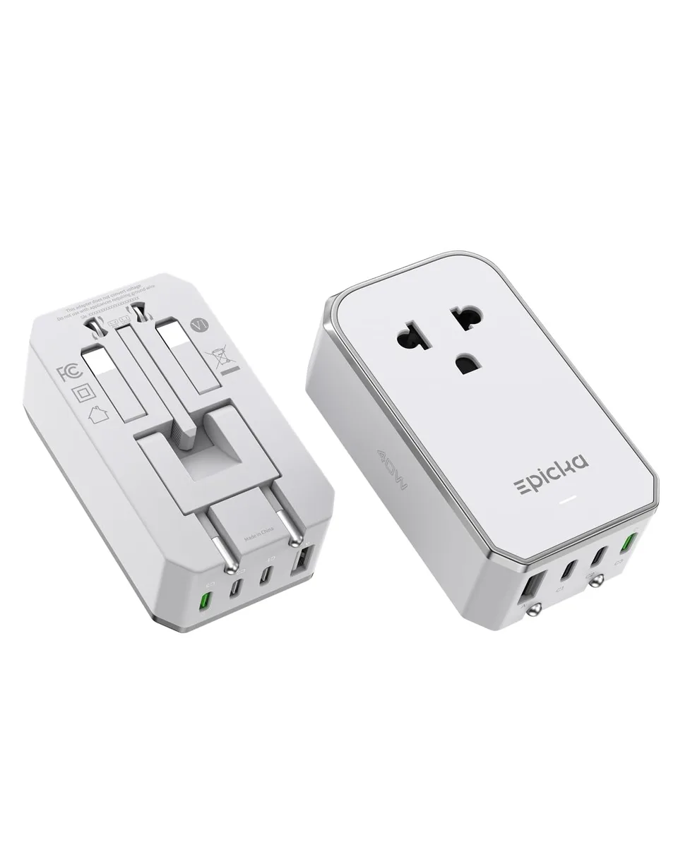 White rectangular travel adapter with foldable prongs and five ports including one AC socket and four USB ports
