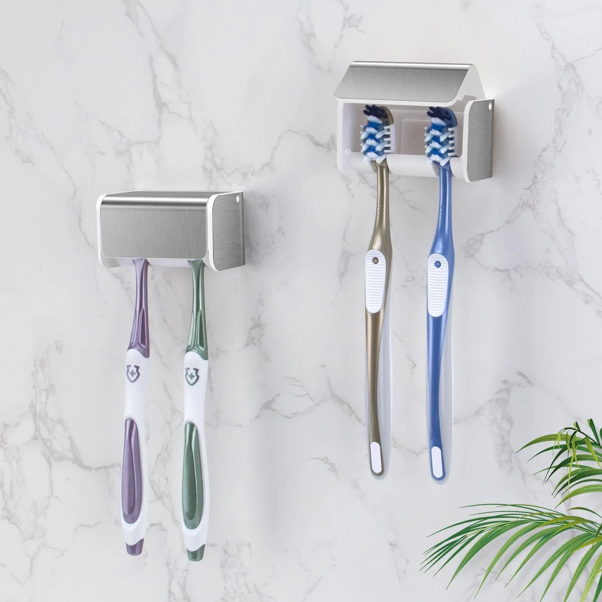 Two brushed silver wall-mounted toothbrush holders with covers, plastic, rectangular form