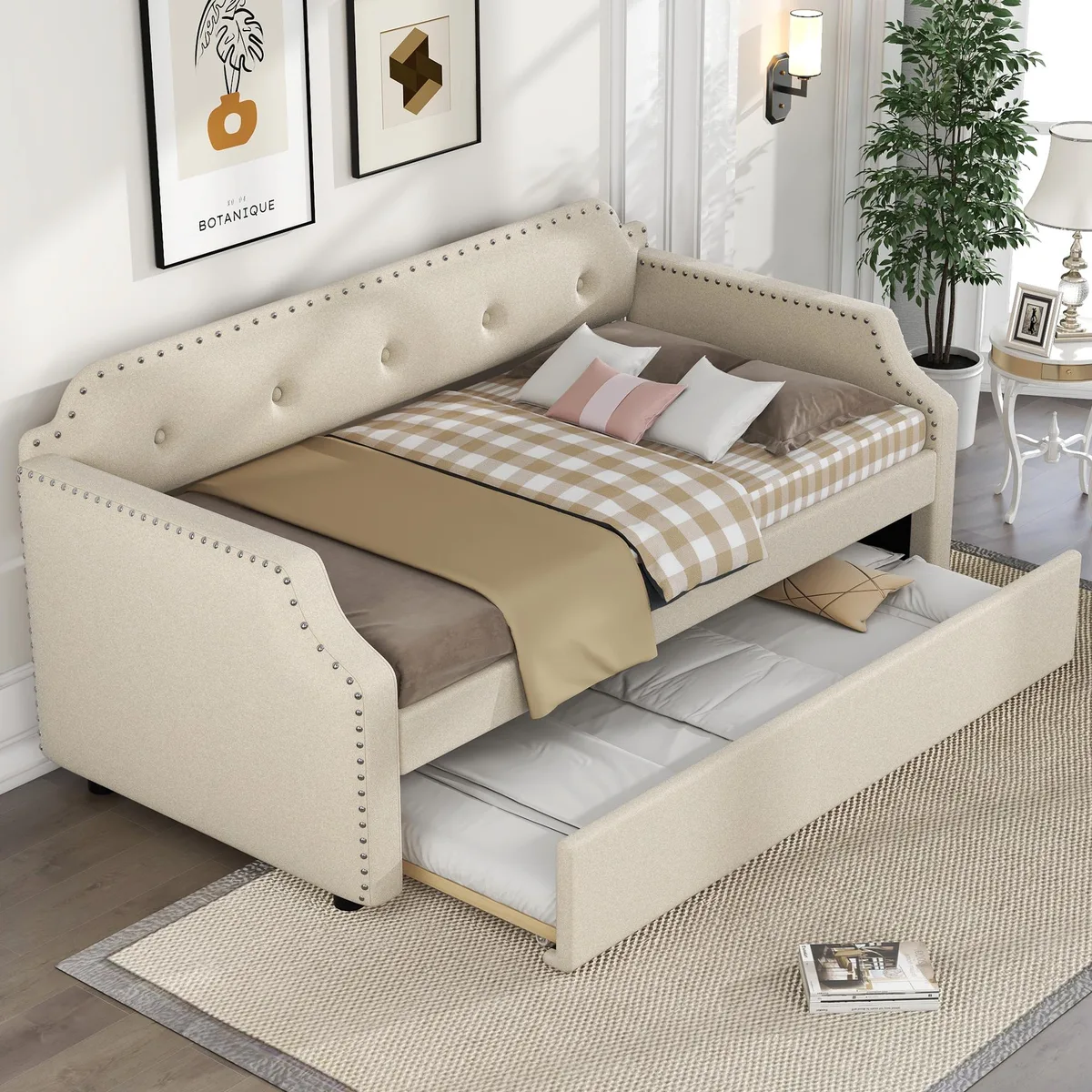 Beige upholstered twin daybed with pull-out trundle and wood slats