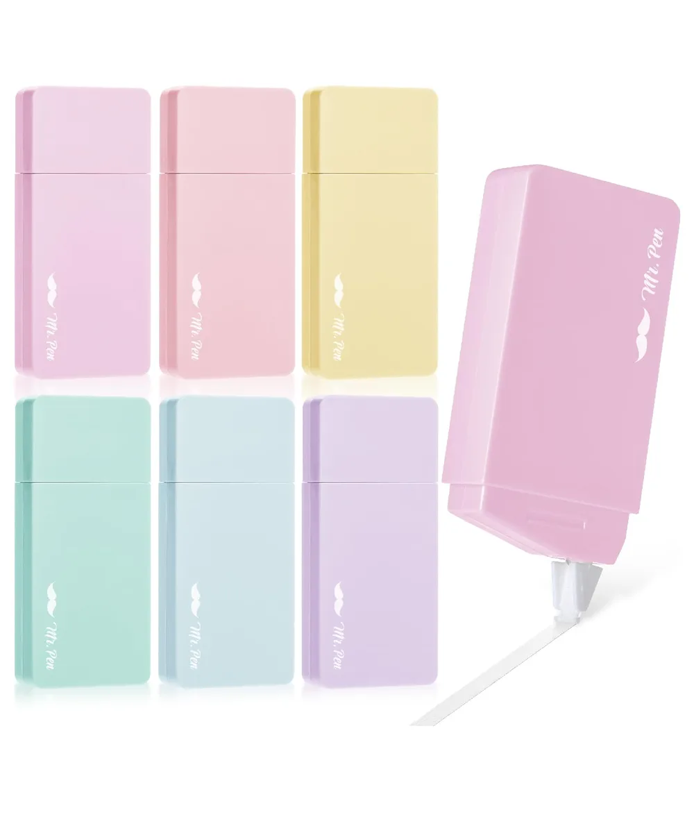 Six pastel-coloured plastic correction tape dispensers in a row
