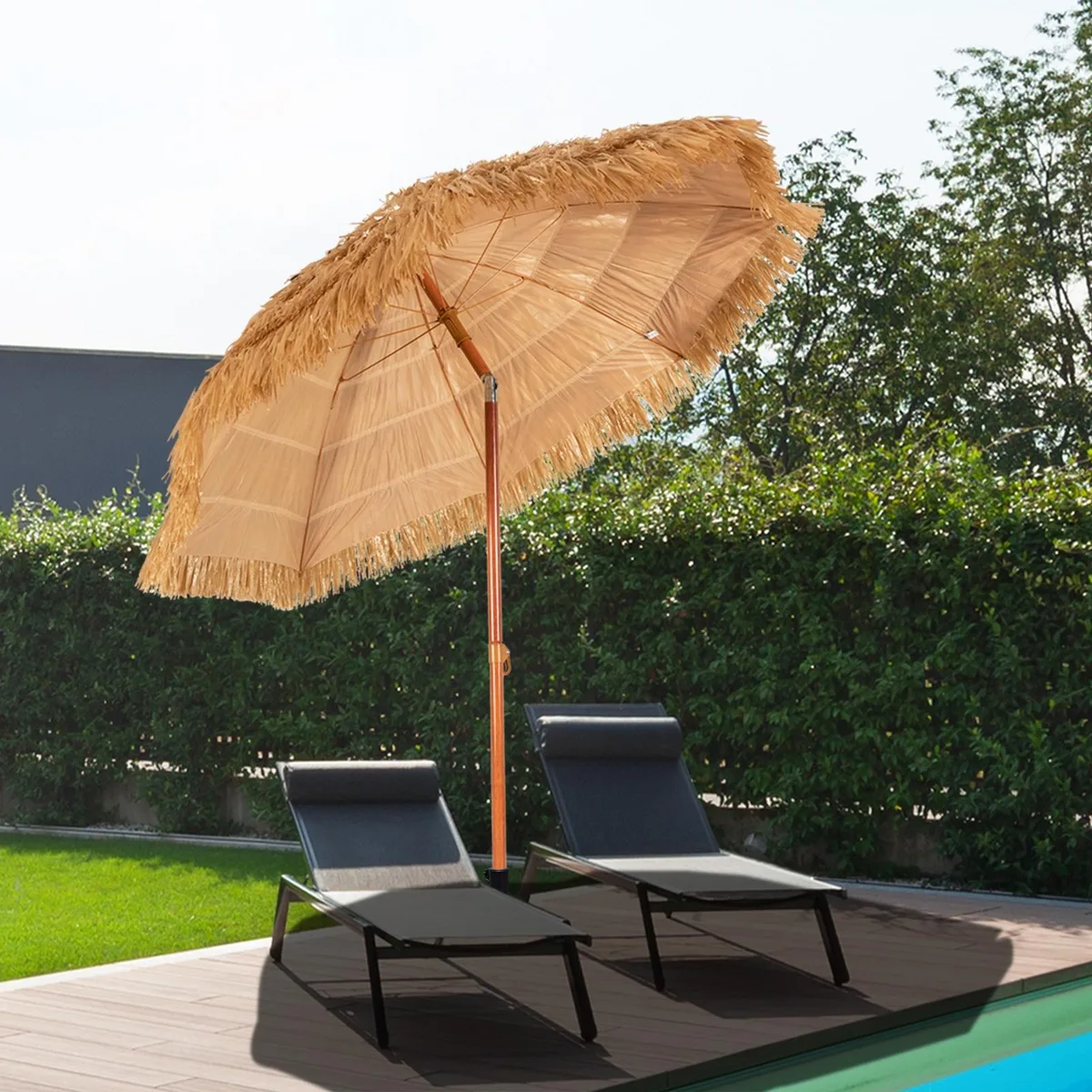 Beige thatched tiki umbrella with metal pole and tilt mechanism