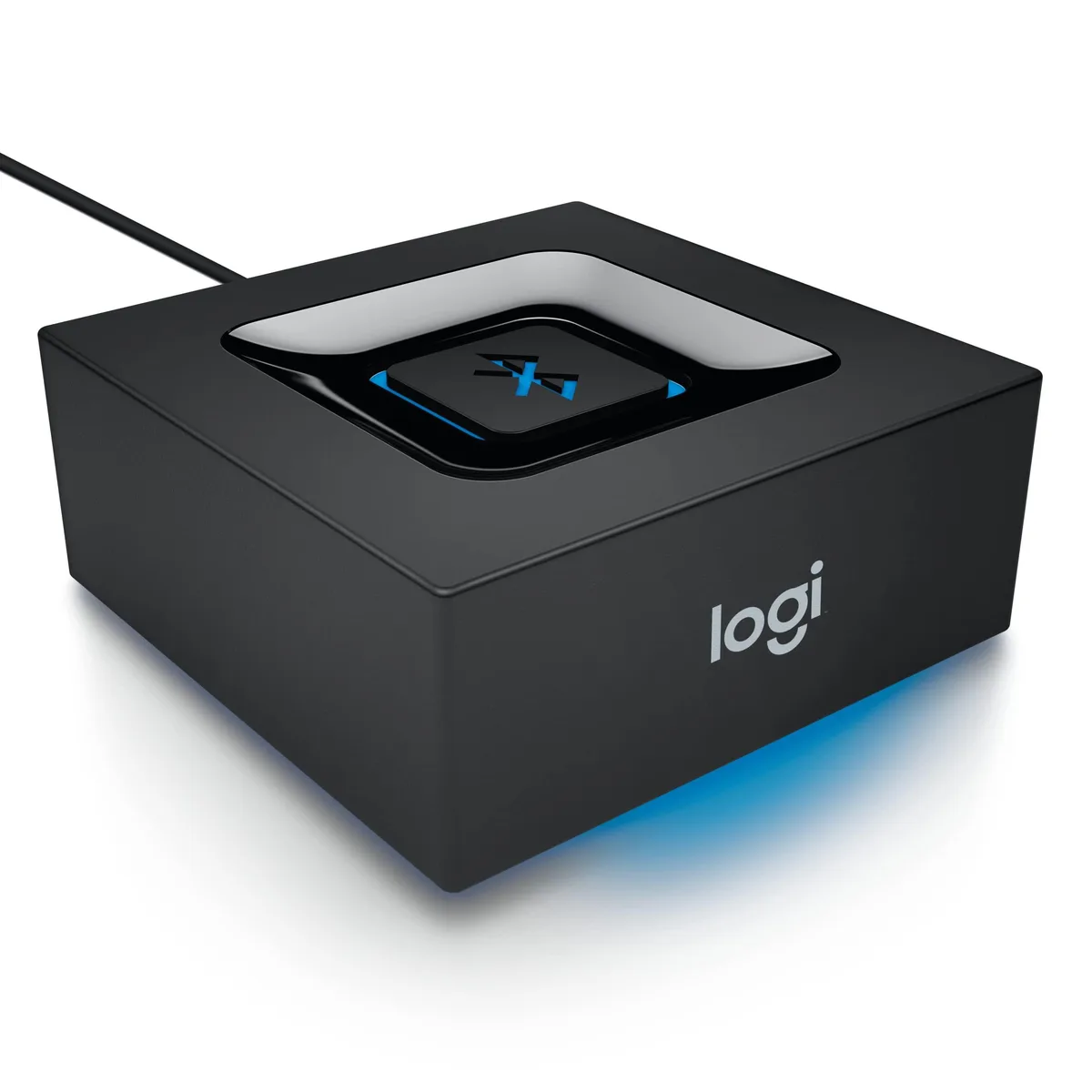 Small black square Bluetooth audio adapter with rounded edges, 3.5 mm and RCA ports, micro-USB power, single pairing button
