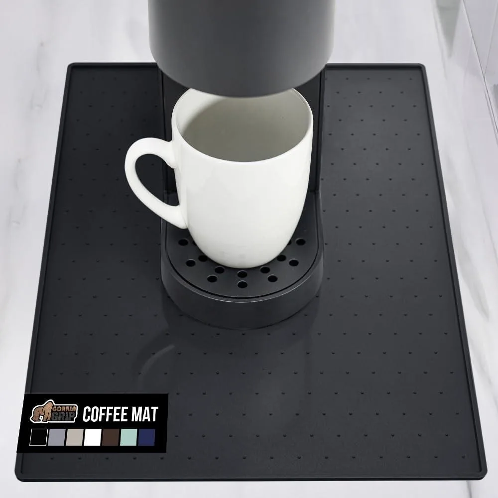Black rectangular silicone mat with raised edges and textured surface, 10 by 14 inches