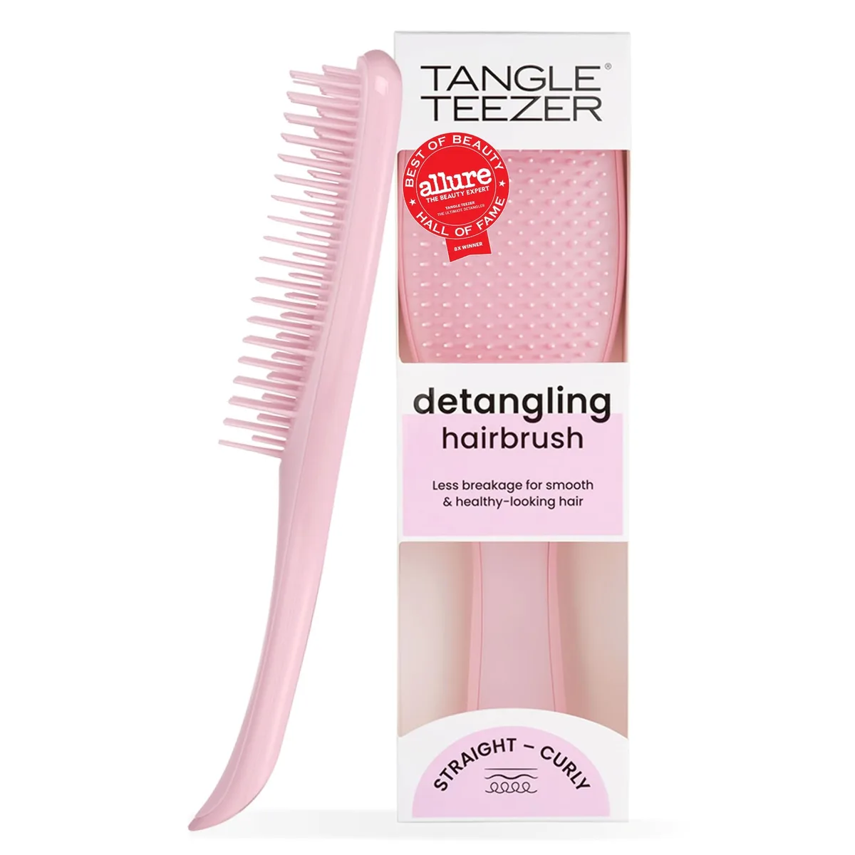 Pink plastic hairbrush with two-tier flexible teeth, compact oval shape