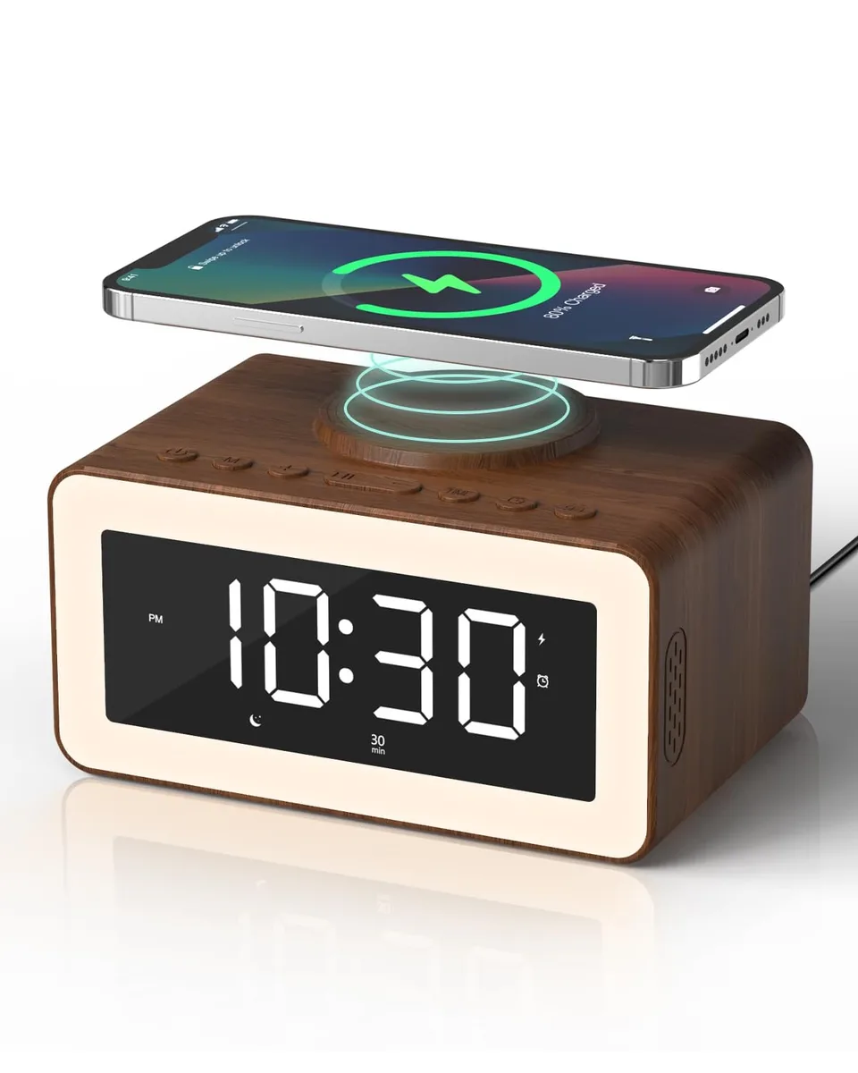 Wooden digital alarm clock with large display, speaker grille and wireless charging pad