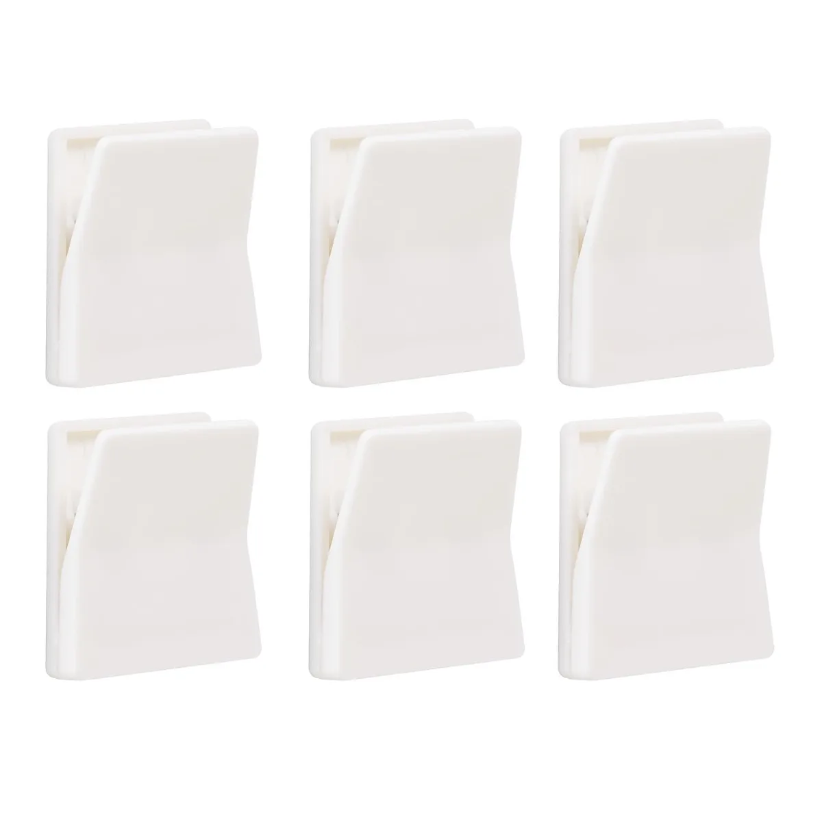 Six white rectangular adhesive wall clips on a surface