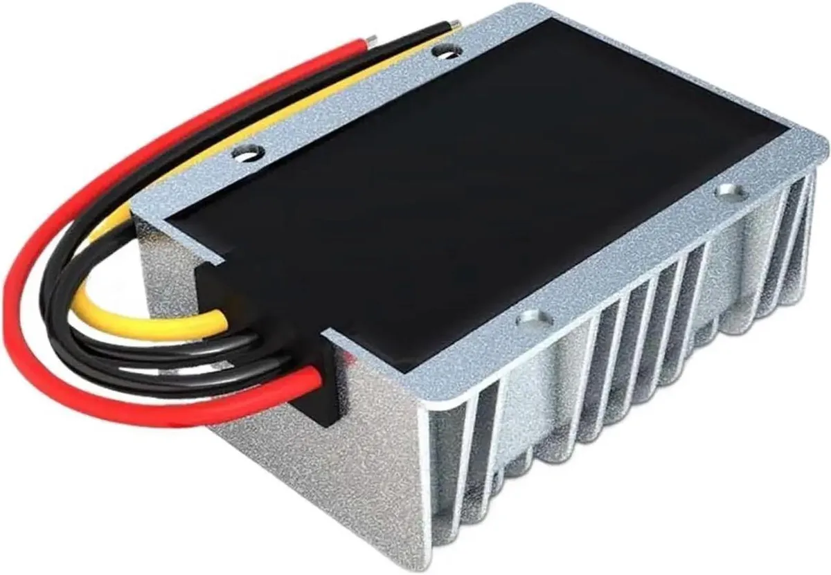 Rectangular metal box with screw terminals and label